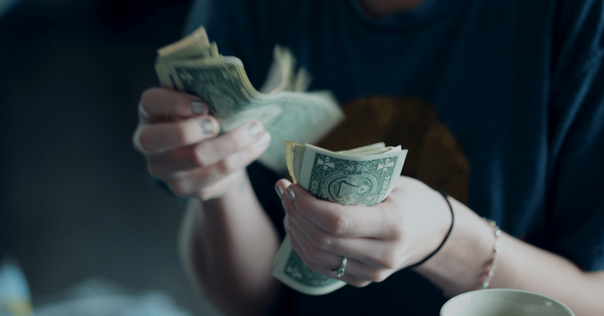Counting money to save the money from his salary